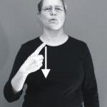 Nainen viittoo taktiililla "kymmenen"